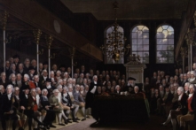 Thủ tướng William Pitt (đứng ở giữa) nói chuyện trước Hạ viện về cuộc chiến tranh bùng nổ với Pháp (1793), sáng tác năm 1798, tác giả Anton Hickel. (Ảnh: Tài liệu công cộng)